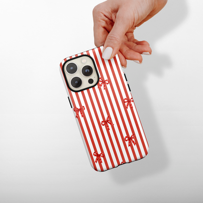 Red and white candy cane stripes with red bows.