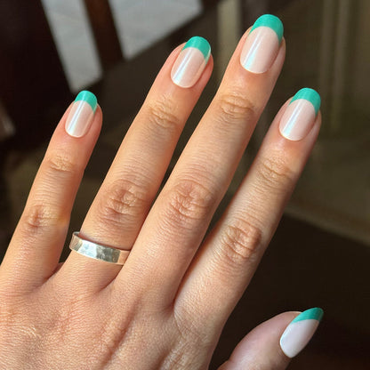 Turquoise Chrome | Short | Round - Tab Press-On nails with sheer base and vibrant turquoise tips for an easy at-home mani