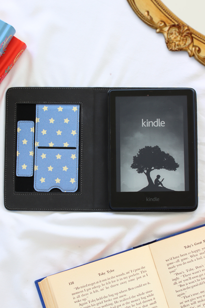 Kindle device with a case featuring star design on a white surface