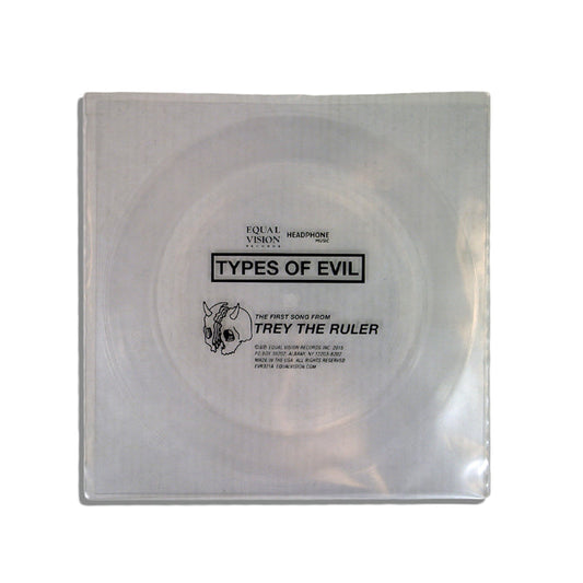 A Clear Flexi Disc vinyl in a clear sleeve labeled "Types of Evil," featuring text about Trey the Ruler, brand logo, and a small horned skull illustration.