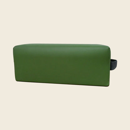 Green upholstered Pilates TV box with a black hook-and-loop carry strap on the side.