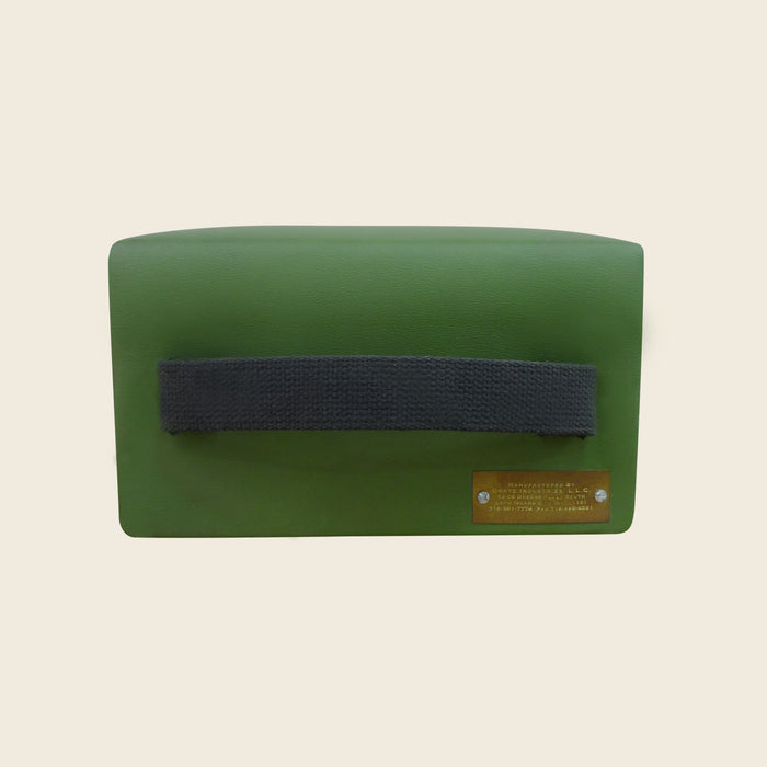Green upholstered Pilates TV box with black carry strap and Gratz brass plate.