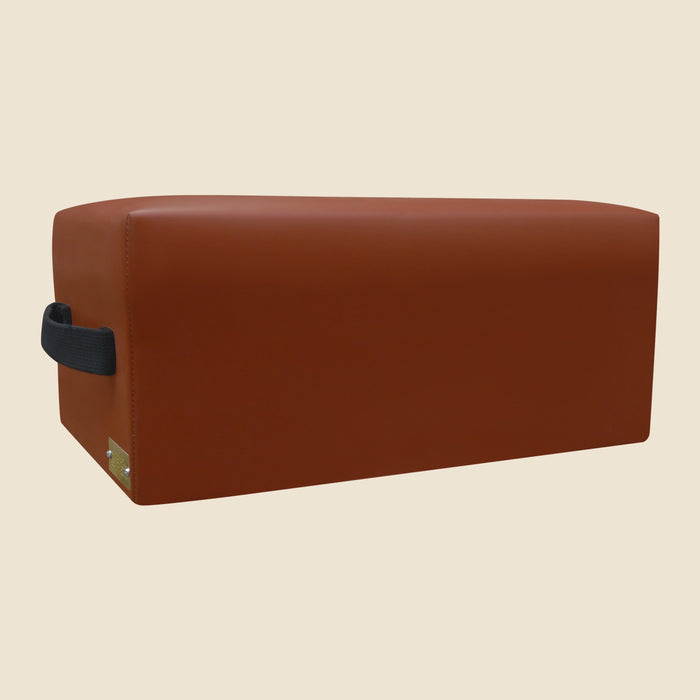 Brown upholstered Gratz Pilates TV box with black carry handle on the side.