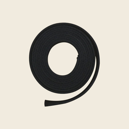 Black 90-inch webbing belly strap for Pilates Cadillac, coiled on a neutral background.