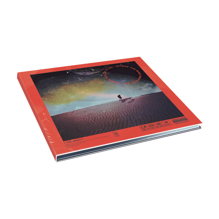 A red-cover vinyl record of Where the World Once Was by I The Mighty, featuring a person in a desert under a starry sky and aurora. Includes tracks like Mind Wants To Go.