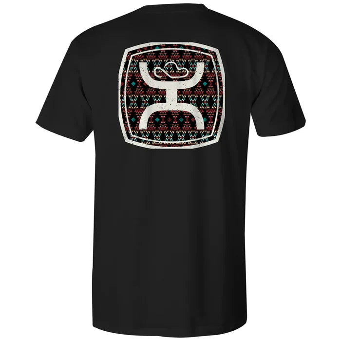 Black t-shirt with a colorful geometric logo on the back against a white background